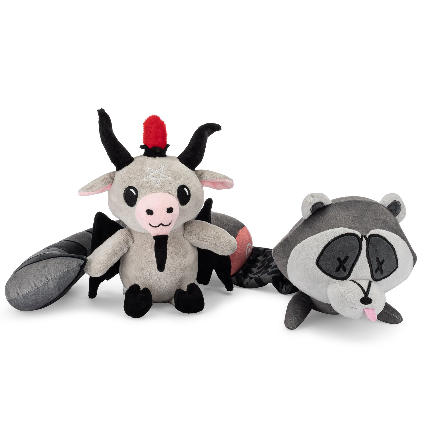 Baphy the baphomet plushie next to a roadkill raccoon plushie.